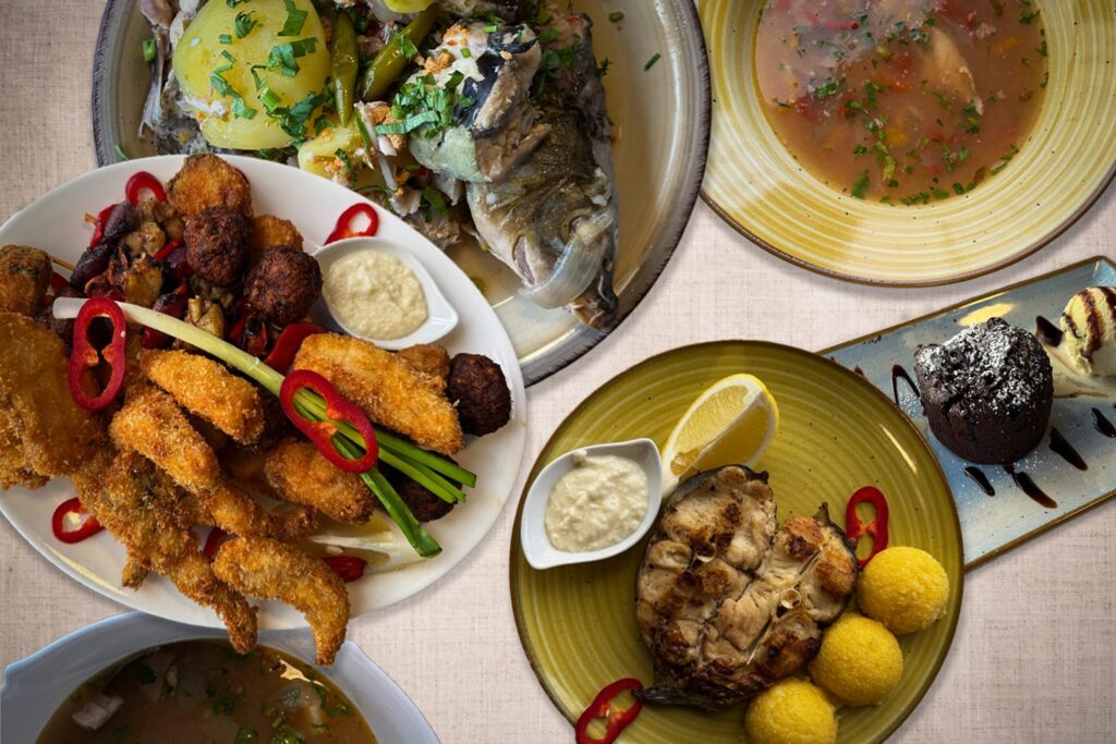 Mehrere Fischgerichte aus dem Donaudelta mit Suppe, gebratenem Fisch, frittierten Spezialitäten und Dessert